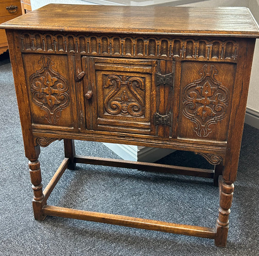 Carved oak side cabinet