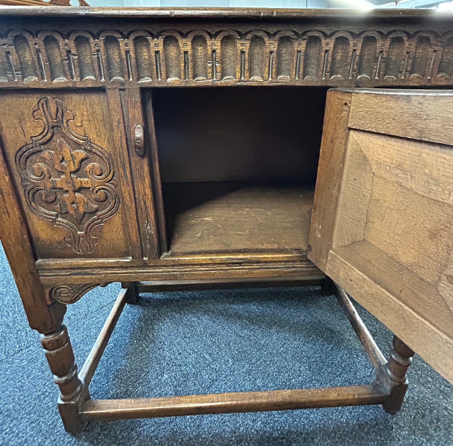 Carved oak side cabinet