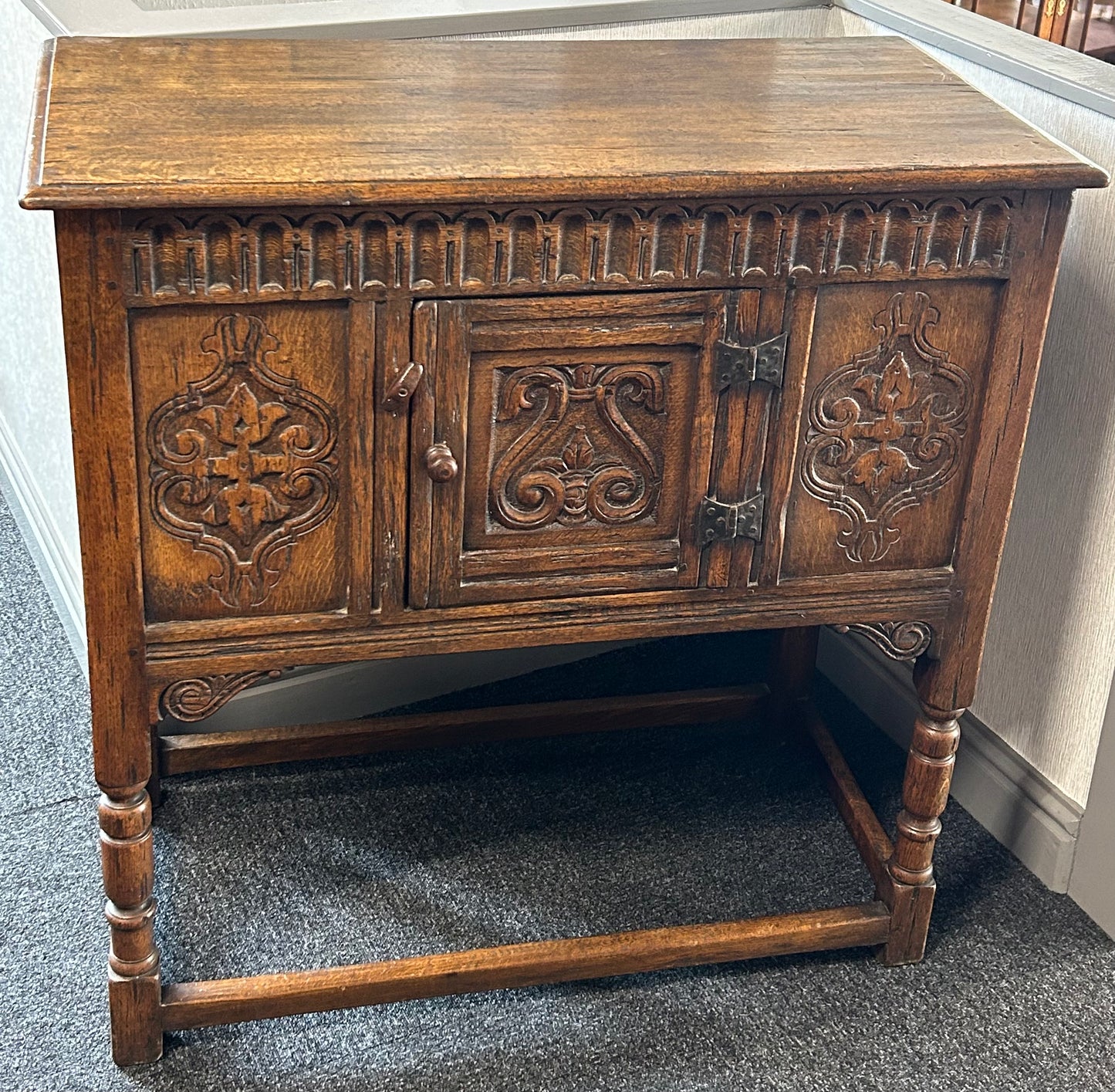 Carved oak side cabinet