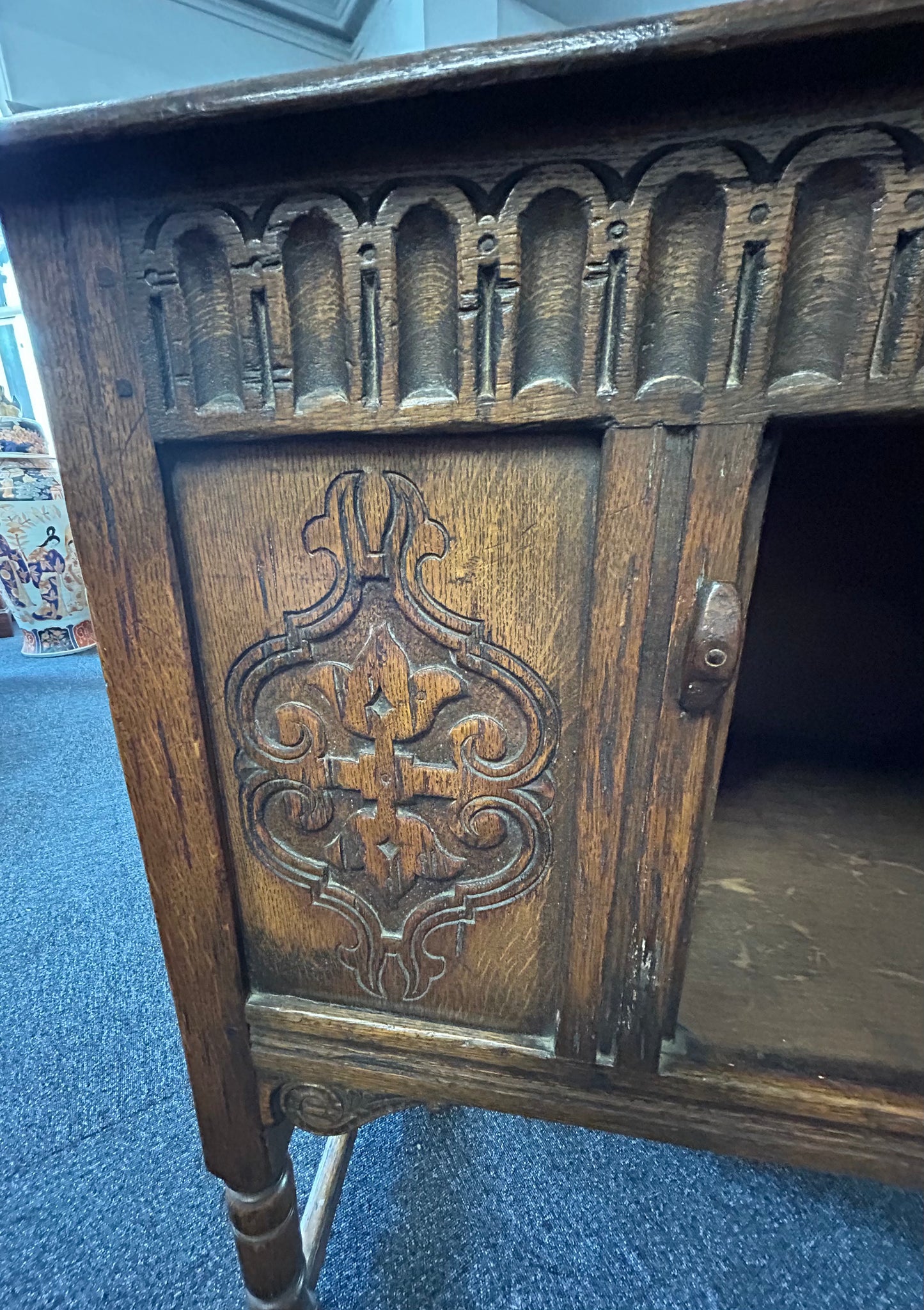 Carved oak side cabinet