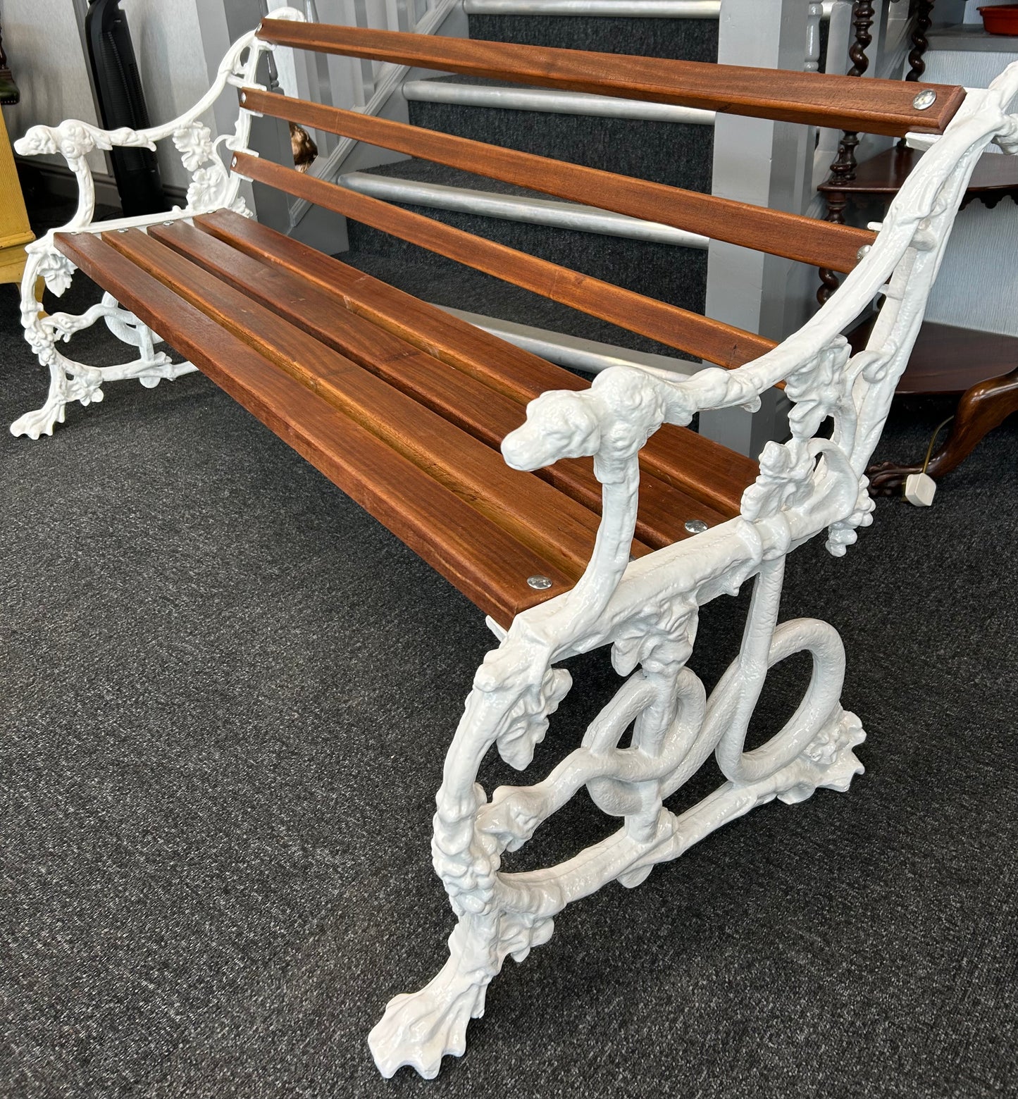 Coalbrookdale style cast iron bench of dog and serpent